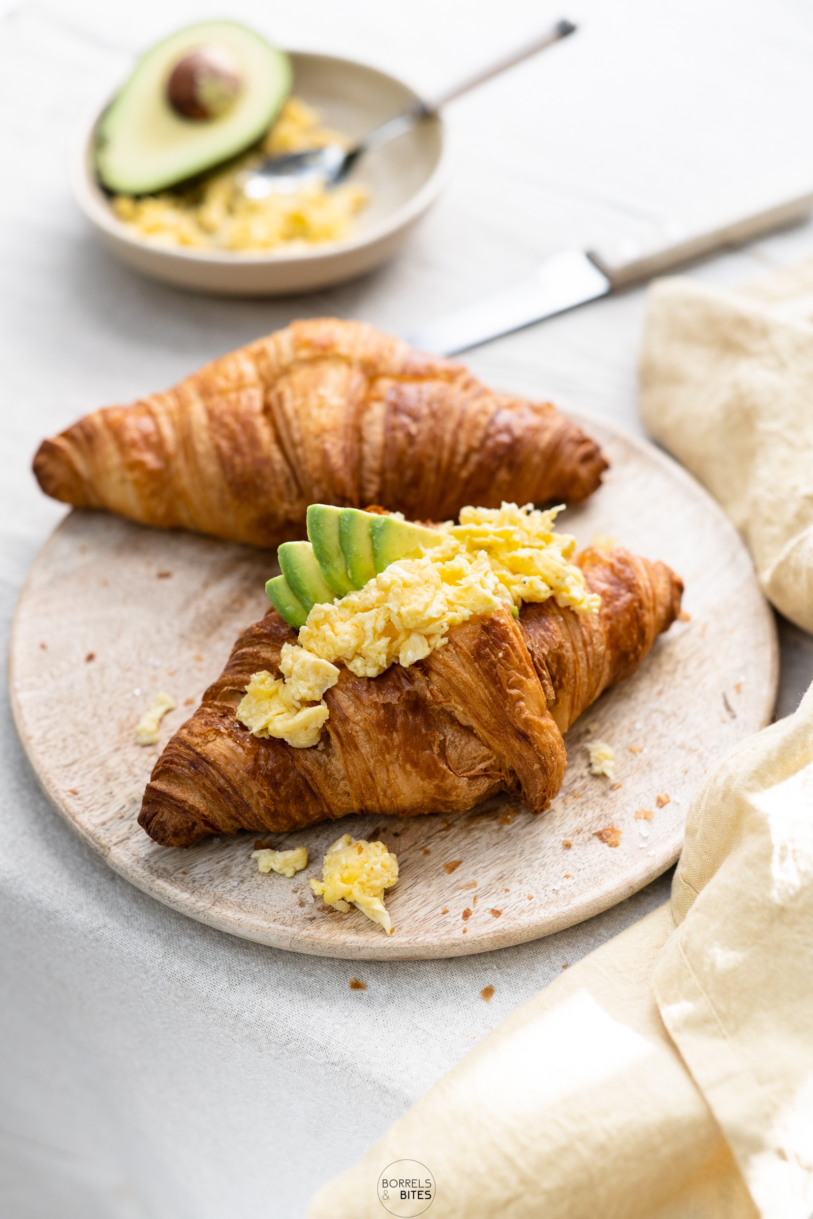 Croissant scrambled eggs avocado